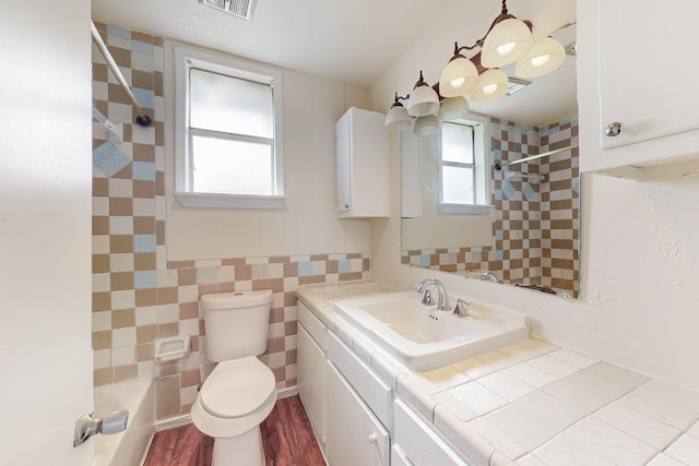 bathroom with vanity, hardwood / wood-style flooring, and toilet