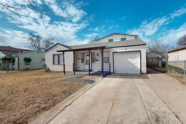 view of front of home featuring a garage, a porch, and a front lawn