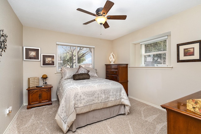 bedroom with light colored carpet and ceiling fan