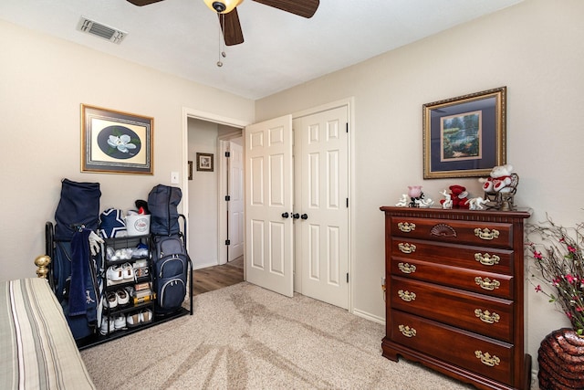 interior space featuring ceiling fan and a closet