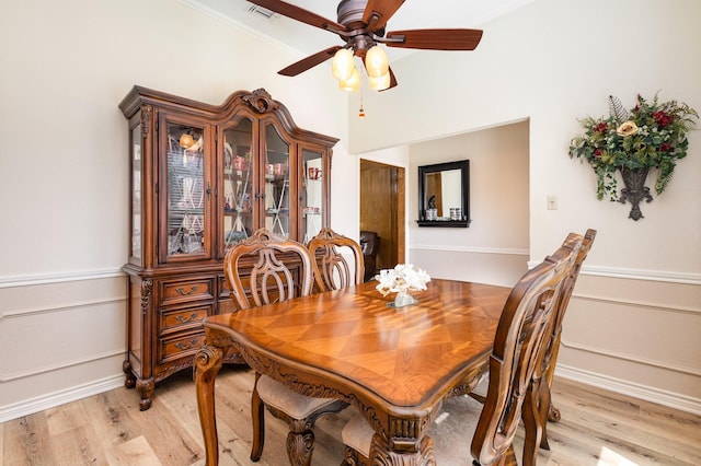 dining area featuring ceiling fan and light wood-type flooring