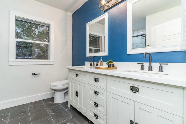 bathroom with vanity, toilet, and a shower with shower door