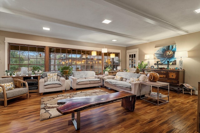 living room with crown molding, beam ceiling, and wood-type flooring