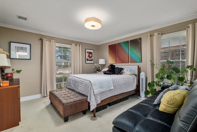 bedroom with crown molding and light carpet