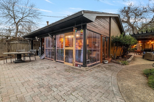 view of property exterior with a patio