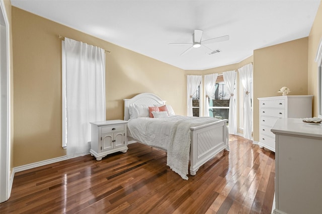 bedroom featuring ceiling fan and dark hardwood / wood-style floors