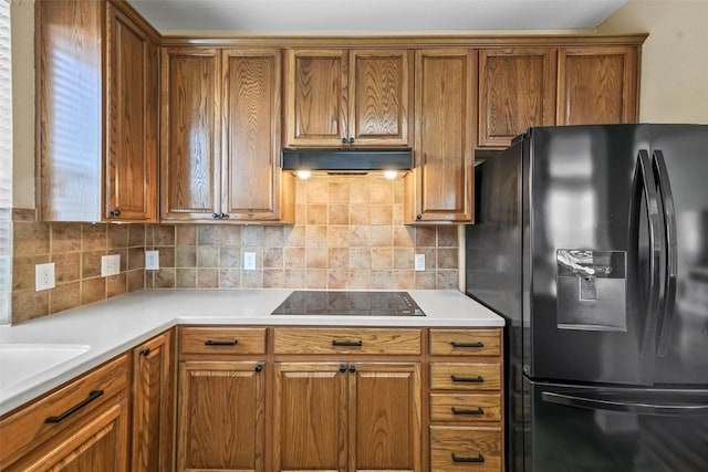 kitchen with tasteful backsplash and black appliances