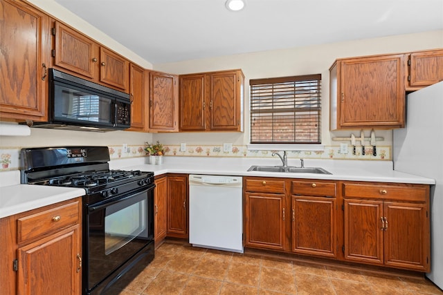 kitchen with sink and black appliances