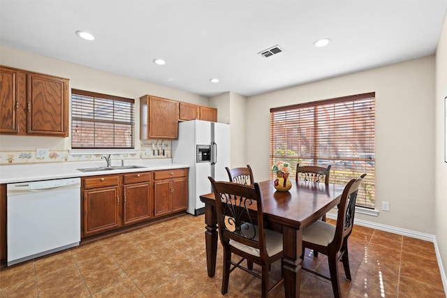 kitchen with white appliances and sink