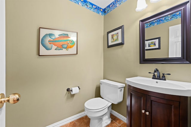 bathroom featuring vanity, tile patterned floors, and toilet