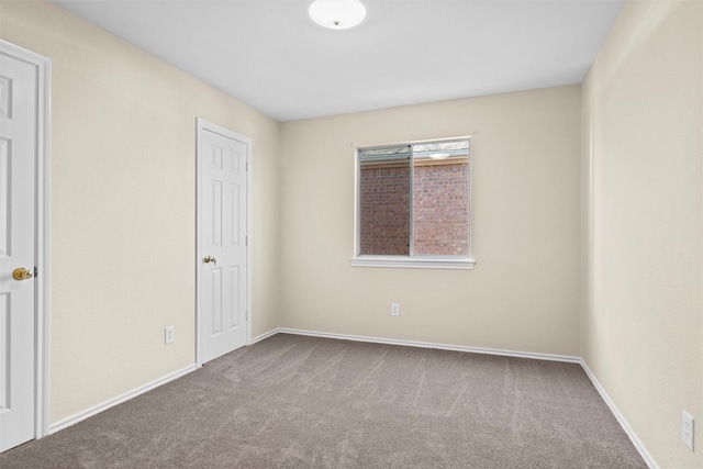 spare room with carpet floors