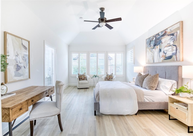 bedroom featuring ceiling fan, lofted ceiling, and light wood-type flooring