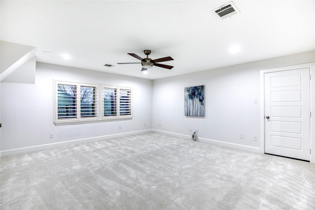 carpeted empty room featuring ceiling fan