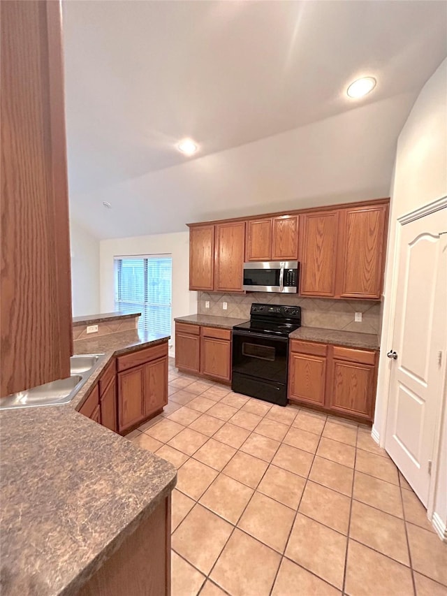 5420 Centeridge Ln, Mckinney, TX 75071 - kitchen with electric range, stainless steel microwave, vaulted ceiling, decorative backsplash, and light tile patterned flooring