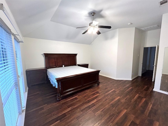 bedroom with ceiling fan, dark hardwood / wood-style floors, and vaulted ceiling