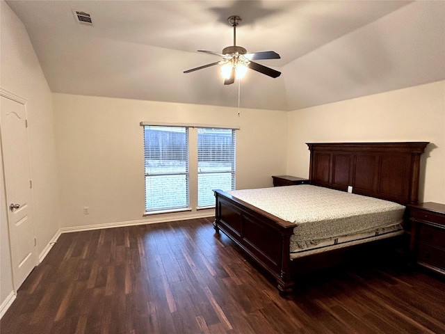 unfurnished bedroom with lofted ceiling, dark wood-type flooring, and ceiling fan