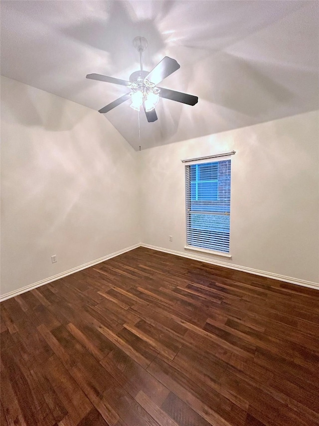 spare room with ceiling fan, lofted ceiling, and dark hardwood / wood-style floors