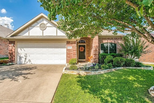 view of front facade with a garage and a front lawn