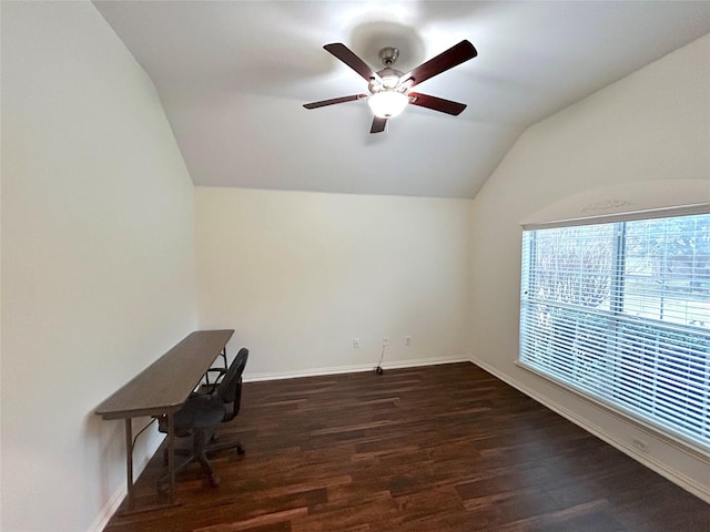 unfurnished office with dark hardwood / wood-style flooring, vaulted ceiling, and ceiling fan