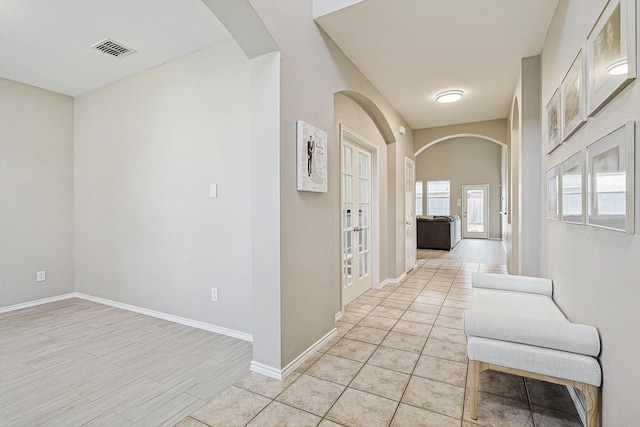 corridor with light tile patterned floors