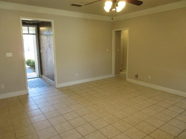 unfurnished room with light tile patterned floors, crown molding, and ceiling fan