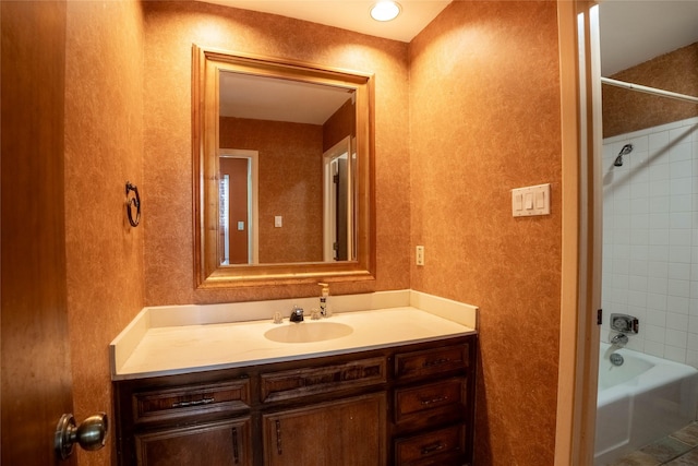 bathroom featuring vanity and tiled shower / bath combo