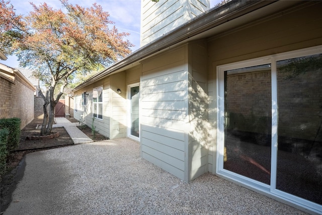 view of side of home with a patio