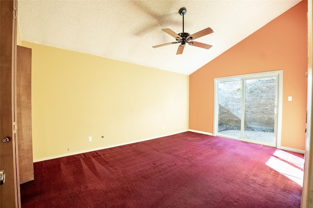 spare room featuring lofted ceiling, a textured ceiling, ceiling fan, and carpet flooring