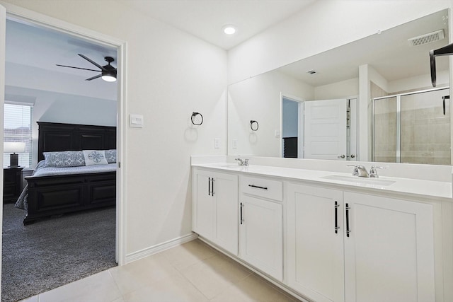 bathroom featuring vanity, tile patterned flooring, ceiling fan, and walk in shower