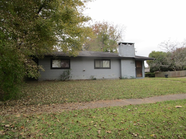 view of home's exterior with a lawn