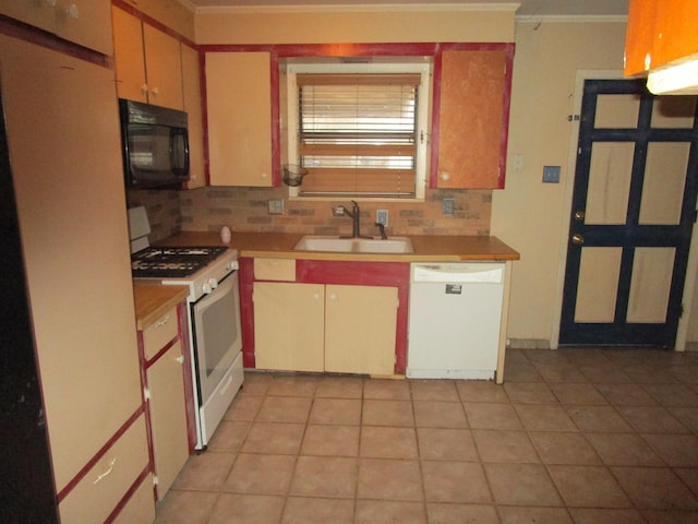 kitchen with sink, crown molding, white appliances, tasteful backsplash, and light tile patterned flooring