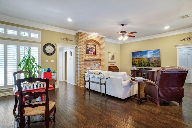 living room with crown molding, dark wood-type flooring, and ceiling fan