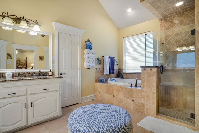 bathroom with lofted ceiling, vanity, tile patterned floors, and shower with separate bathtub