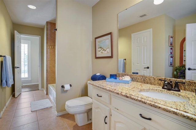 bathroom featuring tile patterned flooring, vanity, and toilet