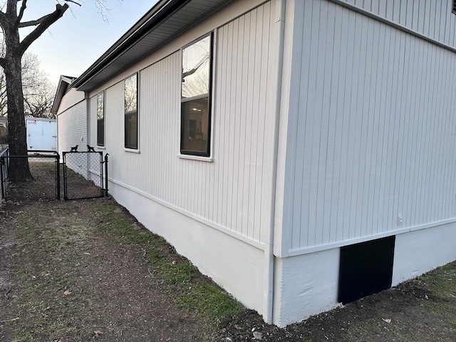 view of property exterior with fence