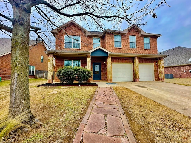 view of front facade with a garage, central AC unit, and a front lawn