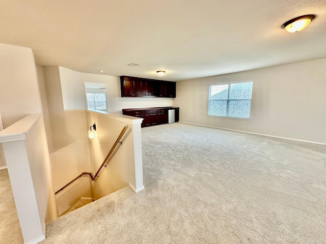 interior space with light colored carpet