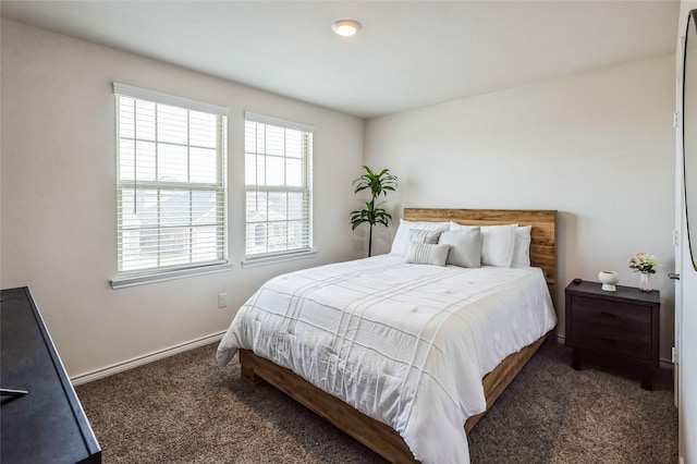 carpeted bedroom with baseboards