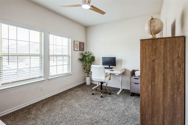 office area with carpet floors, ceiling fan, and baseboards