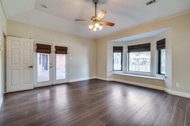 unfurnished room featuring crown molding, dark hardwood / wood-style floors, and french doors