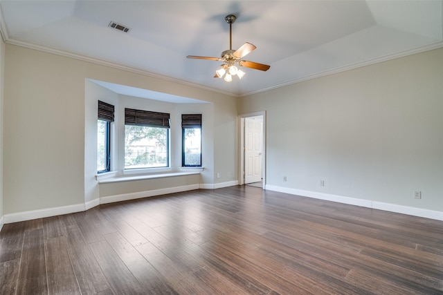 unfurnished room featuring dark wood-type flooring, ceiling fan, and ornamental molding