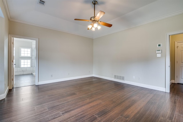 empty room with ceiling fan, ornamental molding, and dark hardwood / wood-style floors