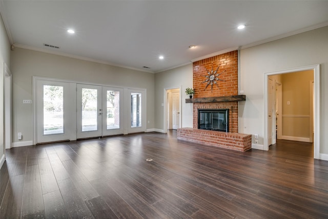 unfurnished living room featuring crown molding, a fireplace, and dark hardwood / wood-style flooring