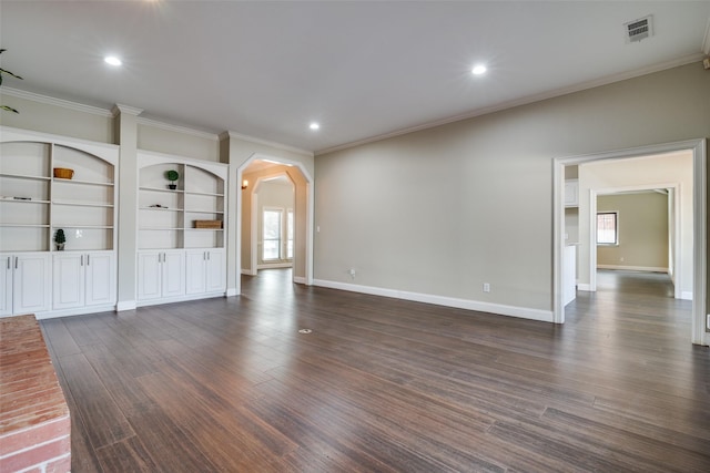 unfurnished living room featuring ornamental molding and dark hardwood / wood-style floors