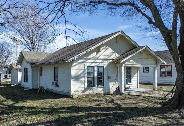 back of house featuring cooling unit, a patio, and a lawn