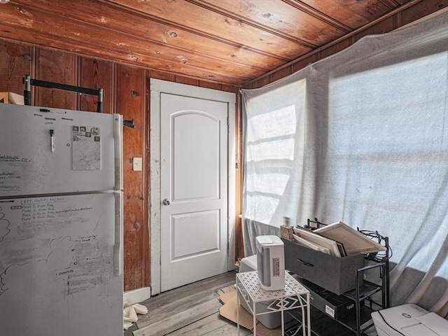 interior space with wood ceiling and light hardwood / wood-style floors