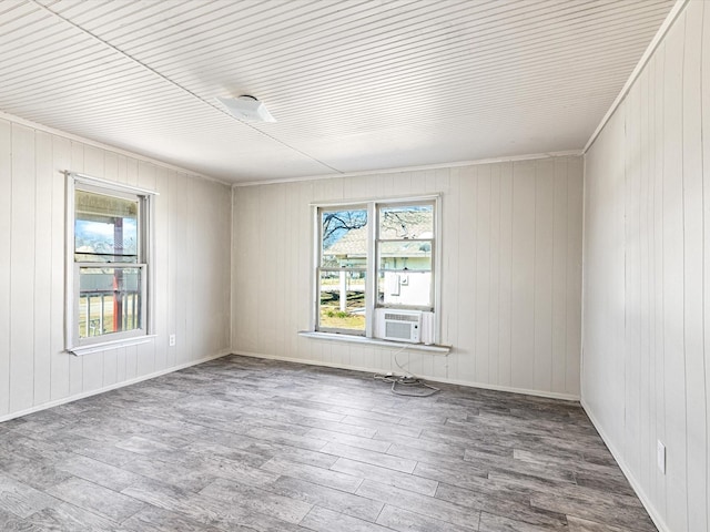 spare room featuring hardwood / wood-style flooring and cooling unit