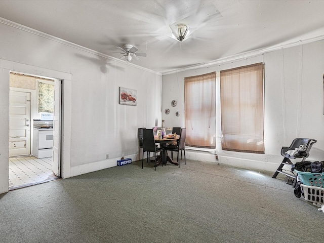 interior space featuring ornamental molding and ceiling fan