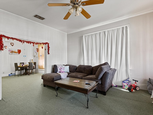 living room featuring ornamental molding, carpet flooring, and ceiling fan