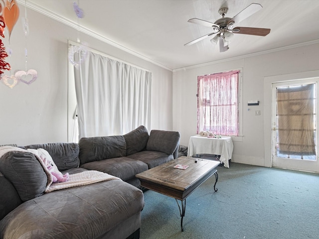 living room featuring crown molding, ceiling fan, and carpet flooring